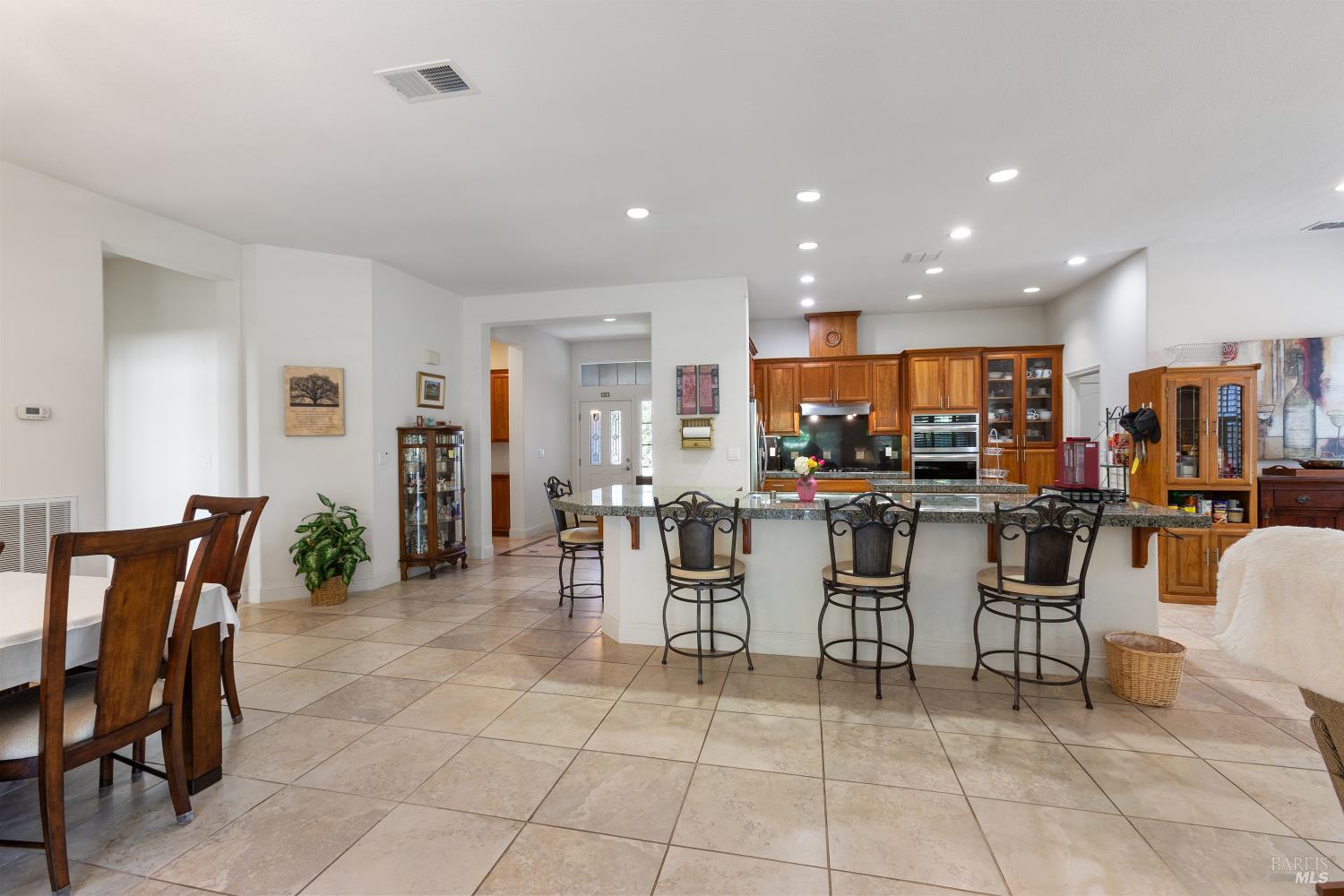 900 Livingston Place Rio Vista, CA 94571 - Photo 10 of 38 a kitchen with a dining table chairs and view of living room