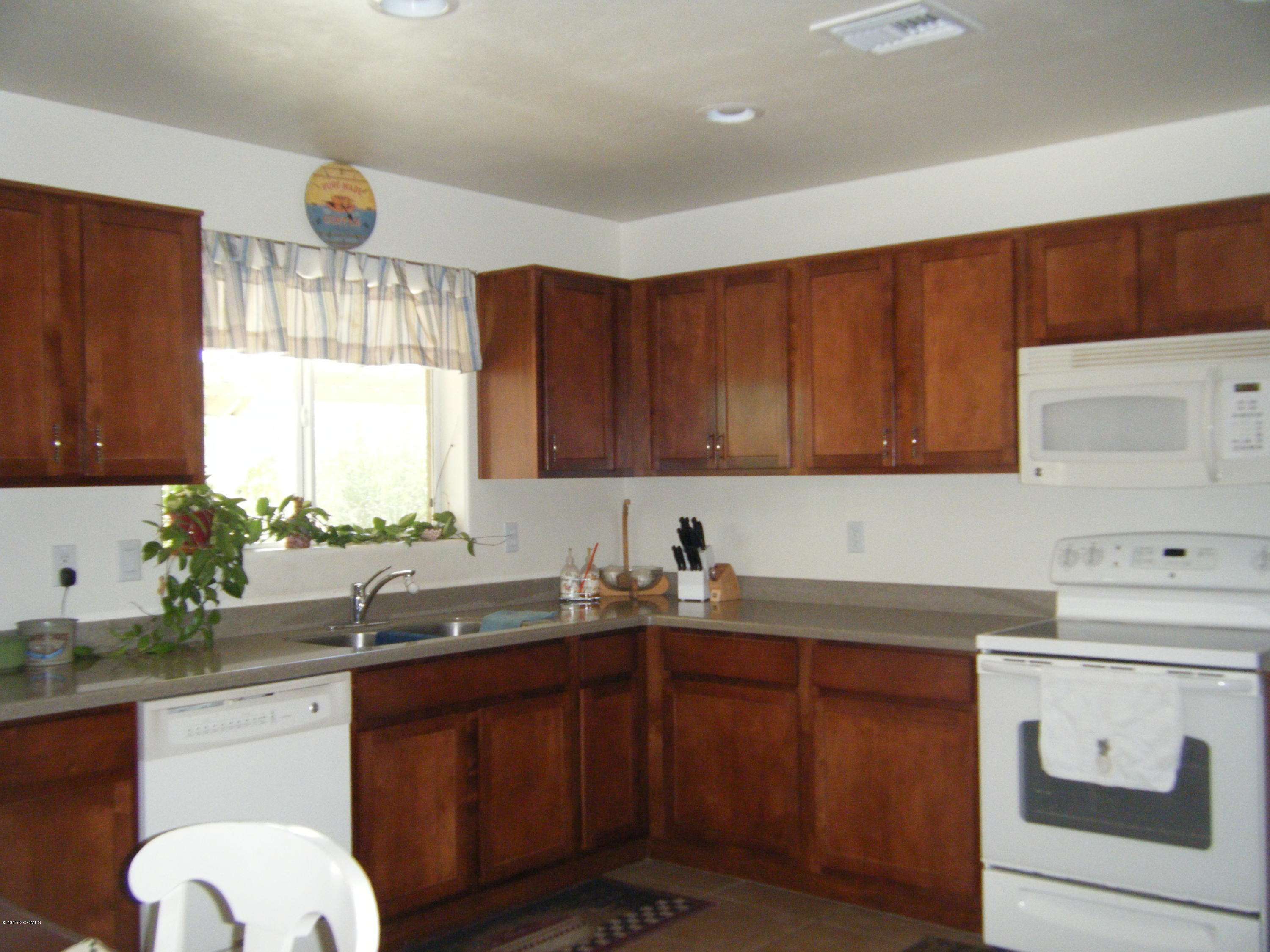 187 Camino Oceano Rio Rico, AZ 85648 - Photo 4 of 23 a kitchen with a sink cabinets and window