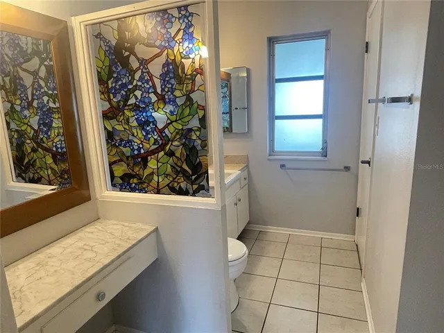 view of a room with window and door