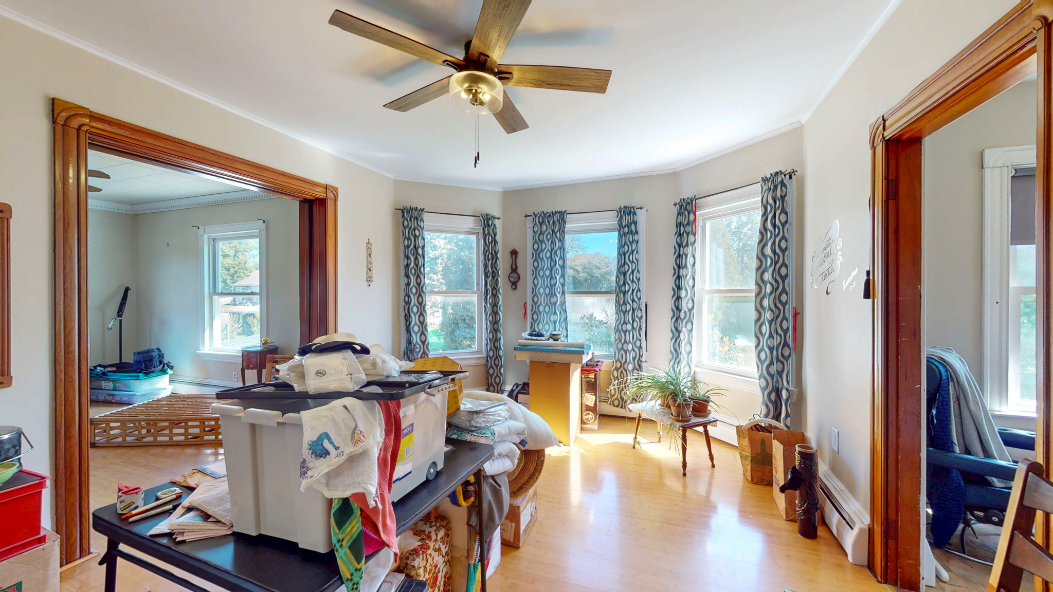 37 Sylvan Street Groton, CT 06340 - Photo 17 of 36 a view of a livingroom with furniture hardwood floor and a ceiling fan