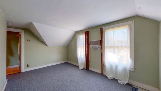 a view of a house with backyard porch and sitting area