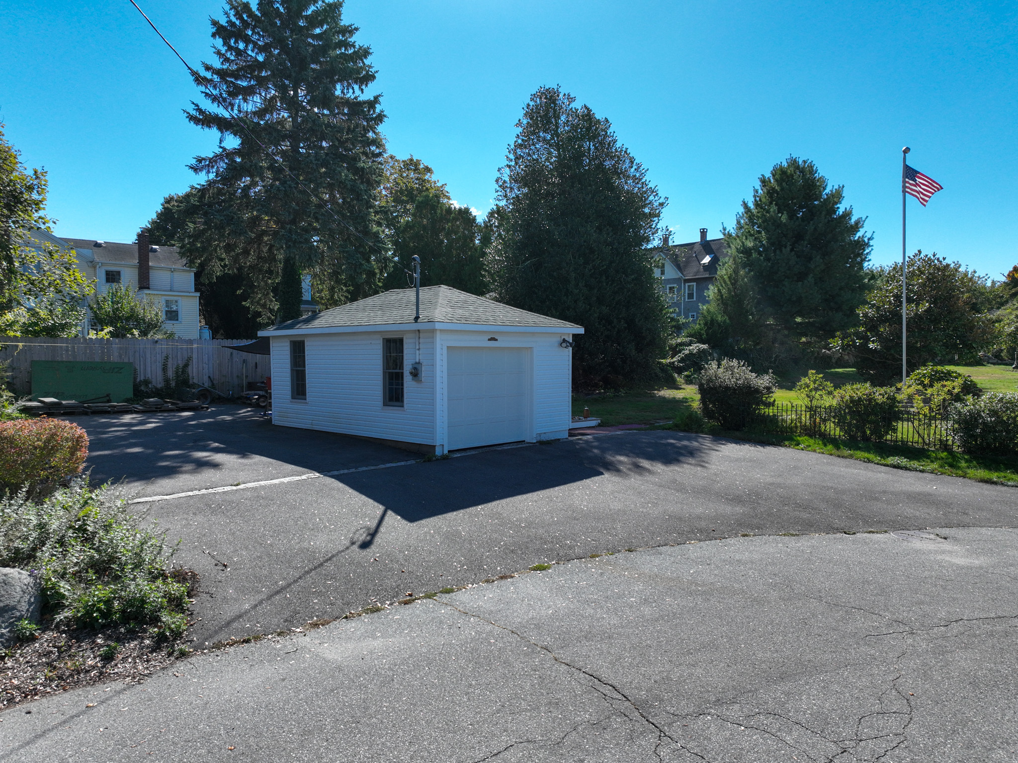37 Sylvan Street Groton, CT 06340 - Photo 33 of 36 a white house with a yard and a large tree