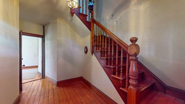 a view of entryway with wooden floor