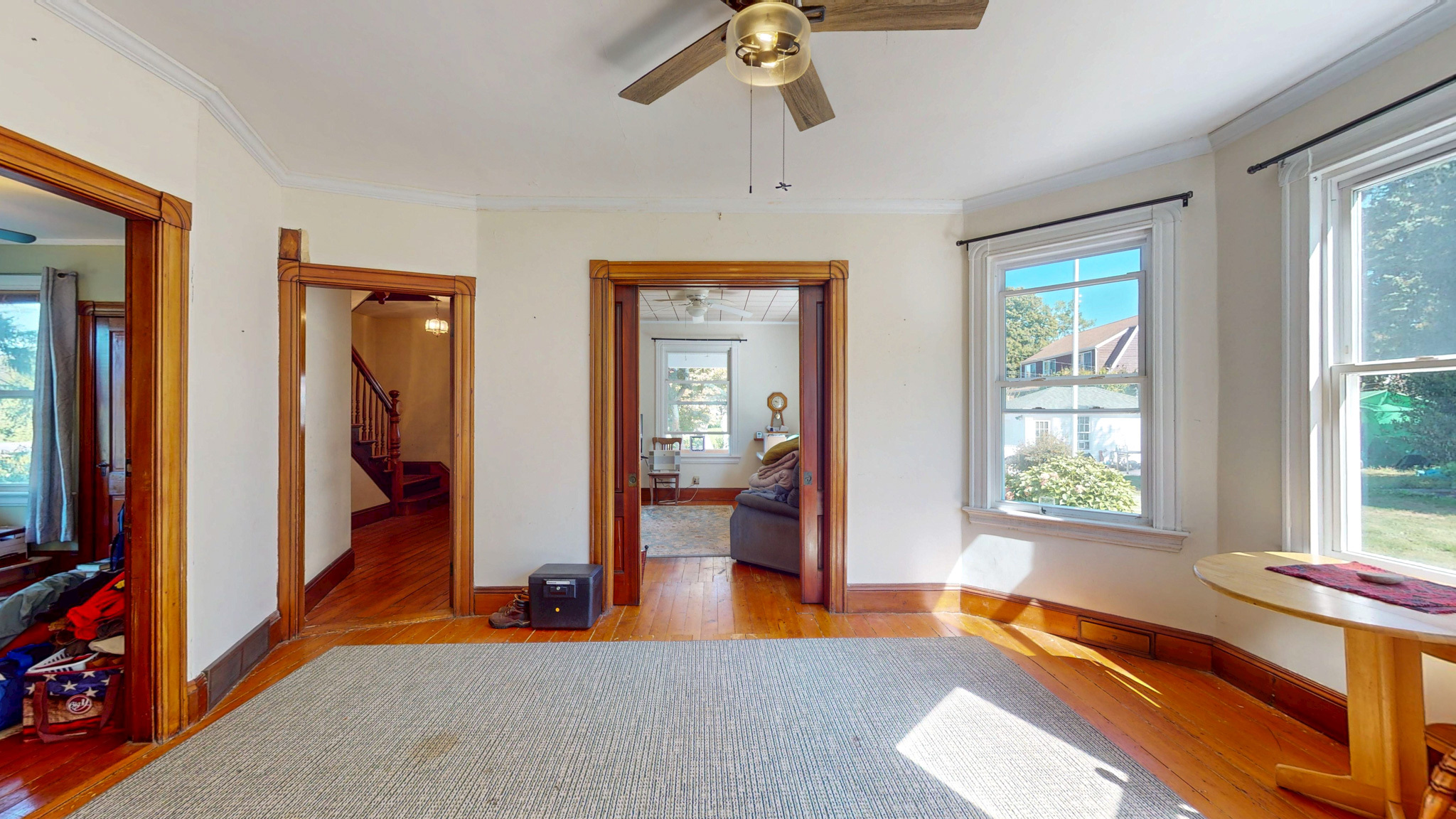 37 Sylvan Street Groton, CT 06340 - Photo 6 of 36 a view of an empty room with wooden floor and windows