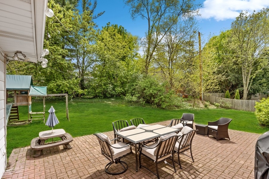 2215 Crestview Lane Wilmette, IL 60091 - Photo 3 of 7 a view of a chair and table in the garden