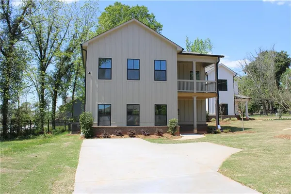 front view of a house with a yard