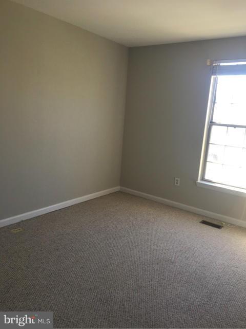 4401 Cole Farm Road Baltimore, MD 21236 - Photo 13 of 21 an empty room with a window