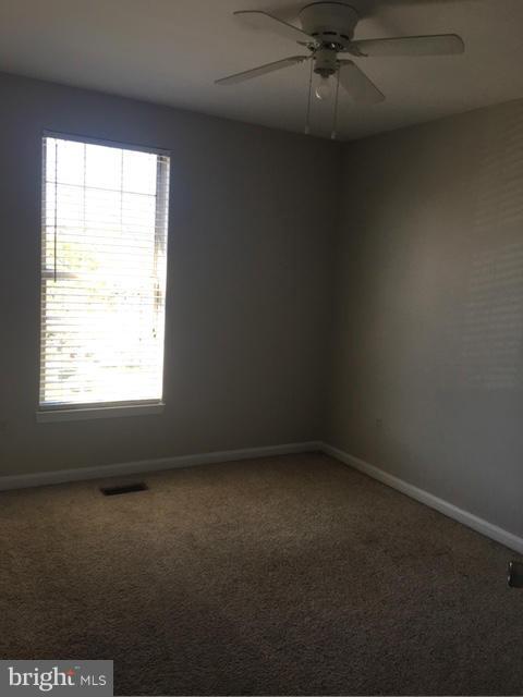 4401 Cole Farm Road Baltimore, MD 21236 - Photo 14 of 21 an empty room with a window