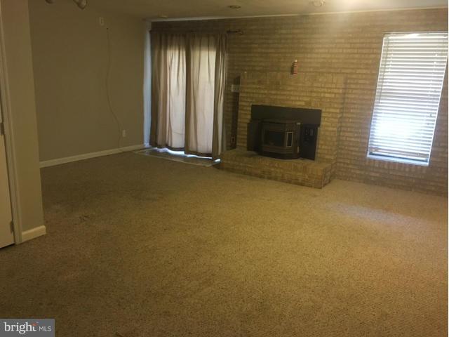 4401 Cole Farm Road Baltimore, MD 21236 - Photo 7 of 21 an empty room with windows