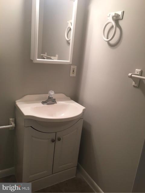 4401 Cole Farm Road Baltimore, MD 21236 - Photo 9 of 21 a sink sitting under a bathroom mirror