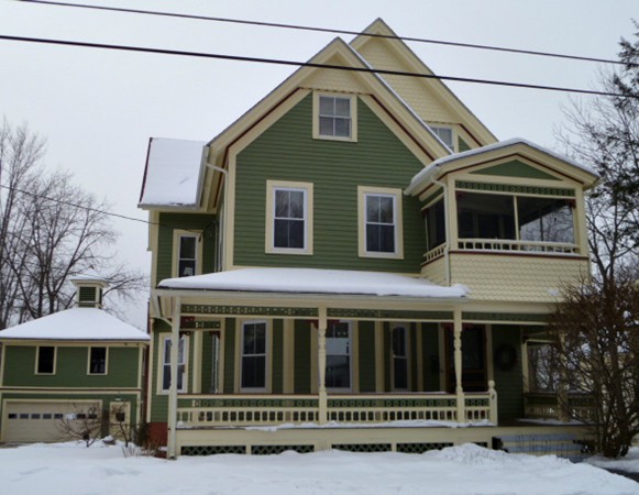 8 Cottage Street Ware, MA 01082 - Photo 1 of 30 a view of a white house with large windows and a small yard