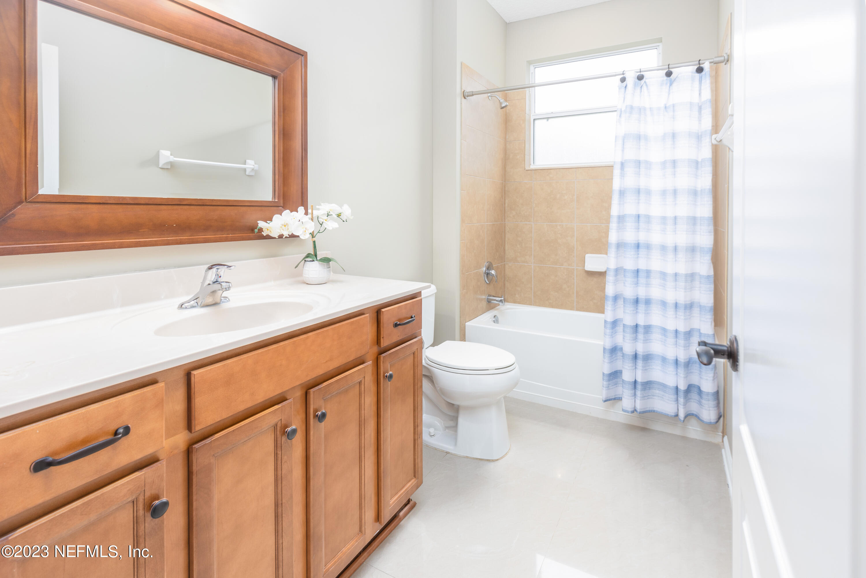 1516 Valhalla Way St. Augustine, FL 32092 - Photo 11 of 46 a bathroom with a sink a toilet and shower