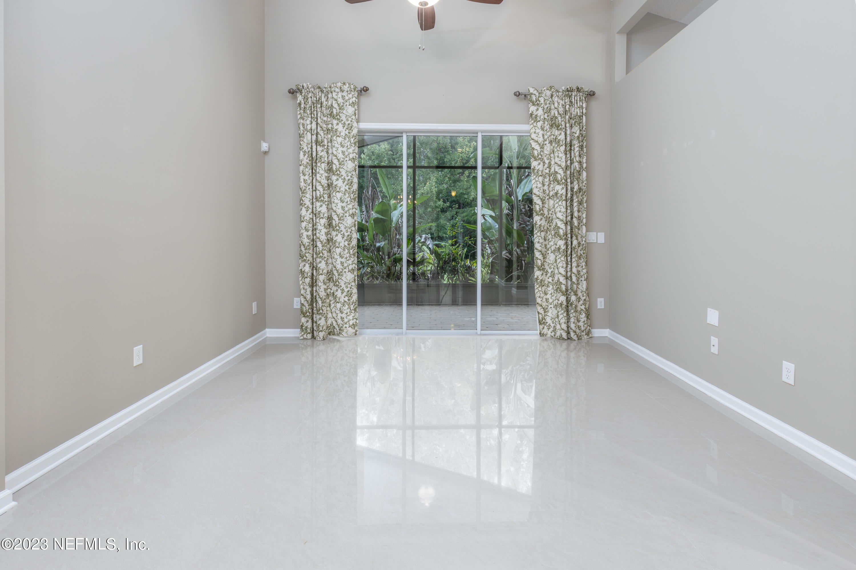 1516 Valhalla Way St. Augustine, FL 32092 - Photo 14 of 46 an empty room with windows and outdoor space