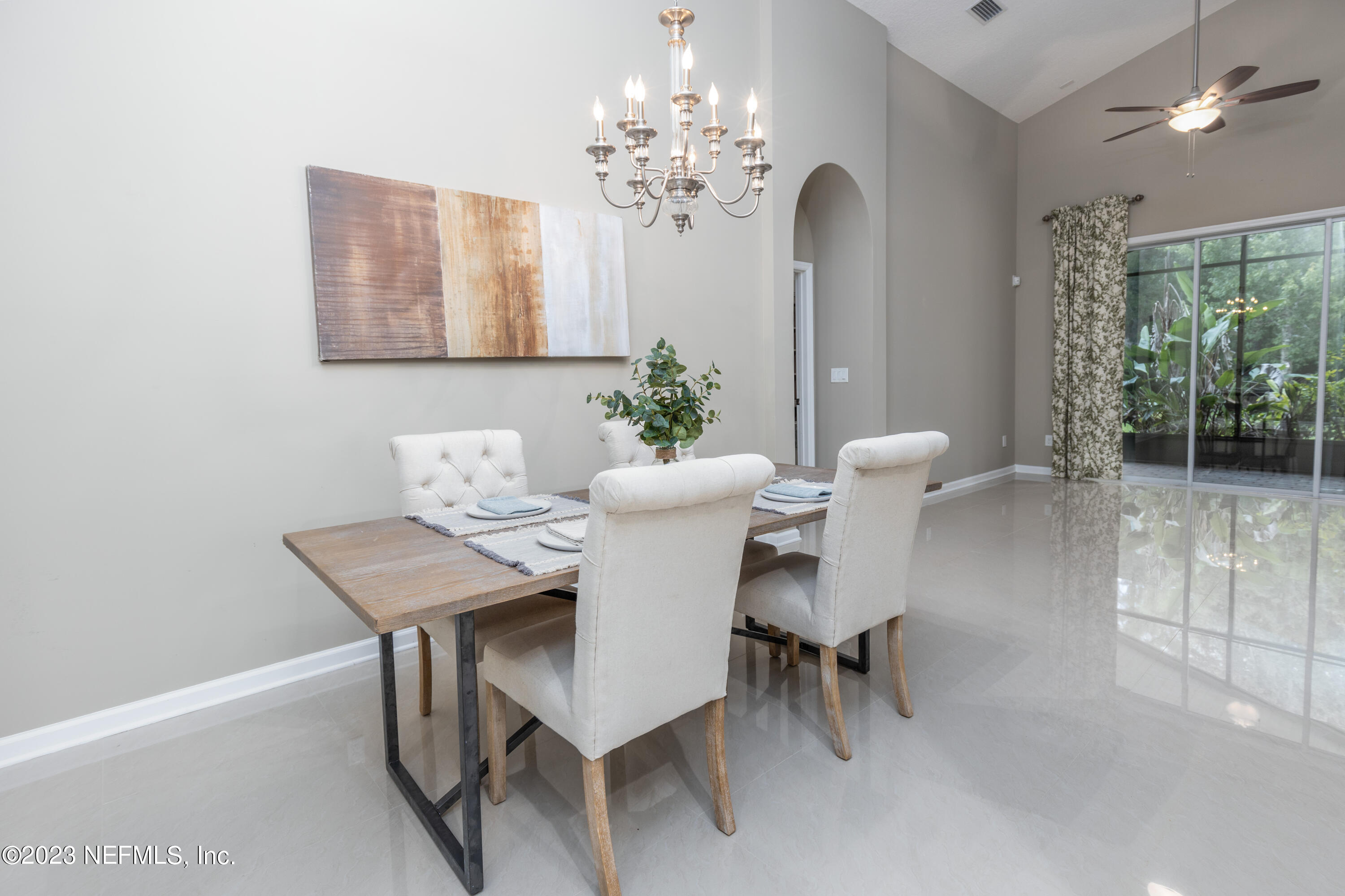 1516 Valhalla Way St. Augustine, FL 32092 - Photo 2 of 46 a view of a dining room with furniture and a chandelier