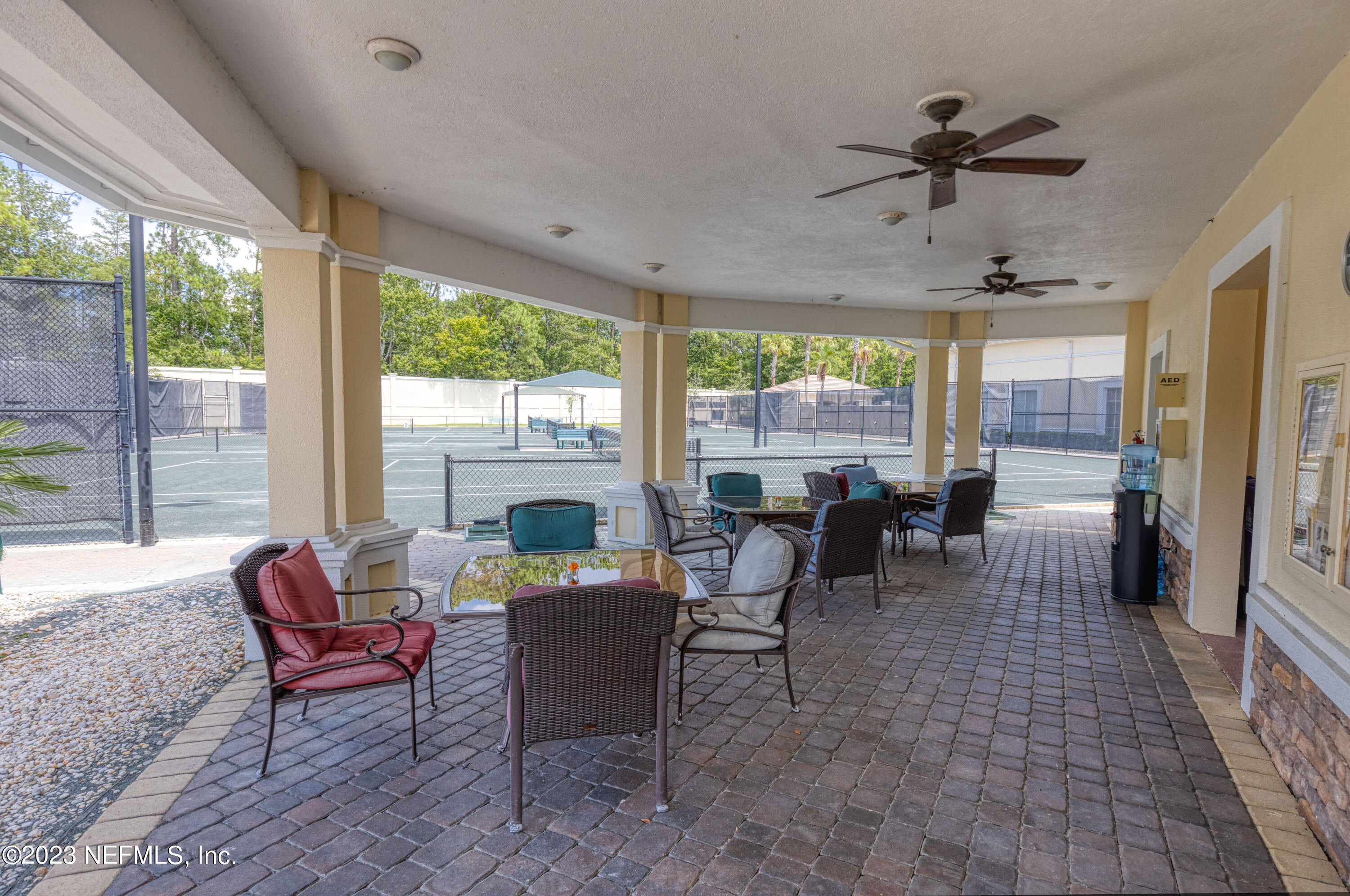 1516 Valhalla Way St. Augustine, FL 32092 - Photo 32 of 46 a living room with furniture floor to ceiling windows and a table