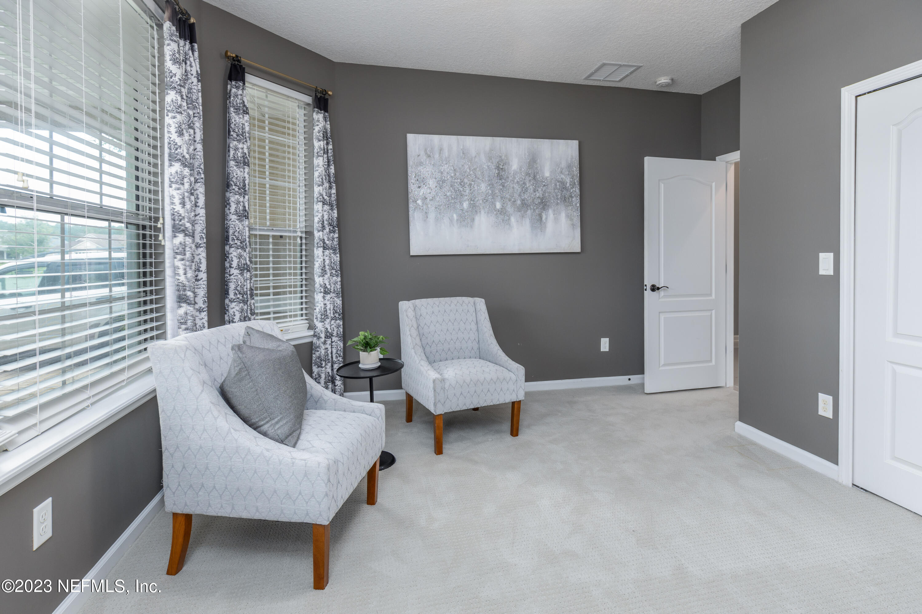 1516 Valhalla Way St. Augustine, FL 32092 - Photo 10 of 46 a living room with furniture and a large window