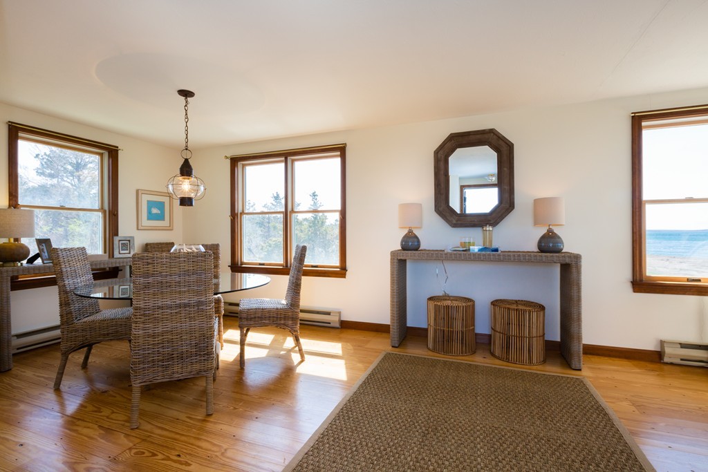 87 Salten Point Road Barnstable, MA 02630 - Photo 12 of 27 a living room with furniture and a fireplace