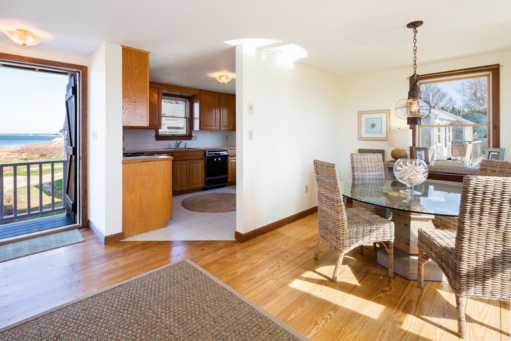 87 Salten Point Road Barnstable, MA 02630 - Photo 13 of 27 a living room with furniture and a table