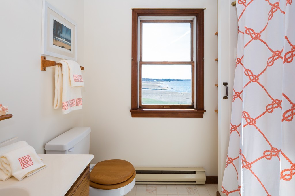 87 Salten Point Road Barnstable, MA 02630 - Photo 17 of 27 a bathroom with a toilet and a shower curtain