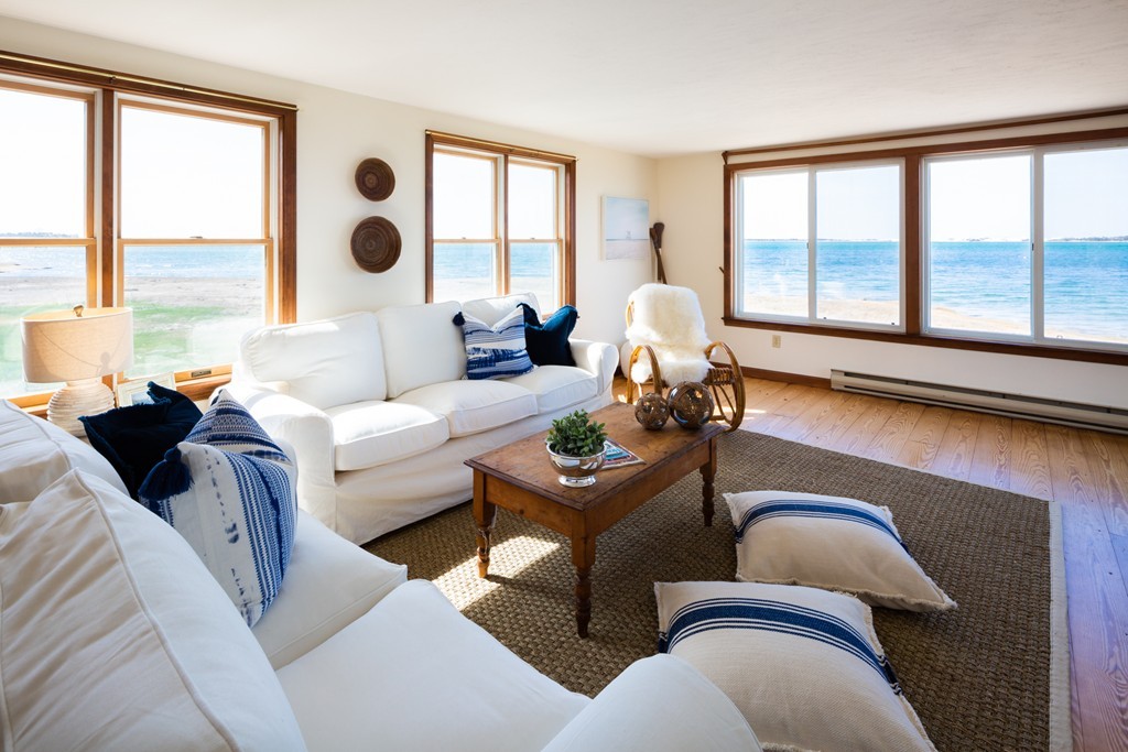 87 Salten Point Road Barnstable, MA 02630 - Photo 8 of 27 a living room with furniture and a large window