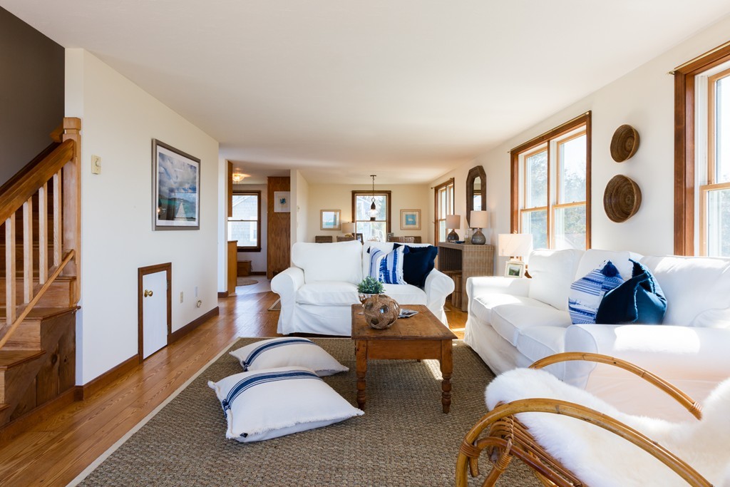 87 Salten Point Road Barnstable, MA 02630 - Photo 9 of 27 a living room with fireplace furniture and a window