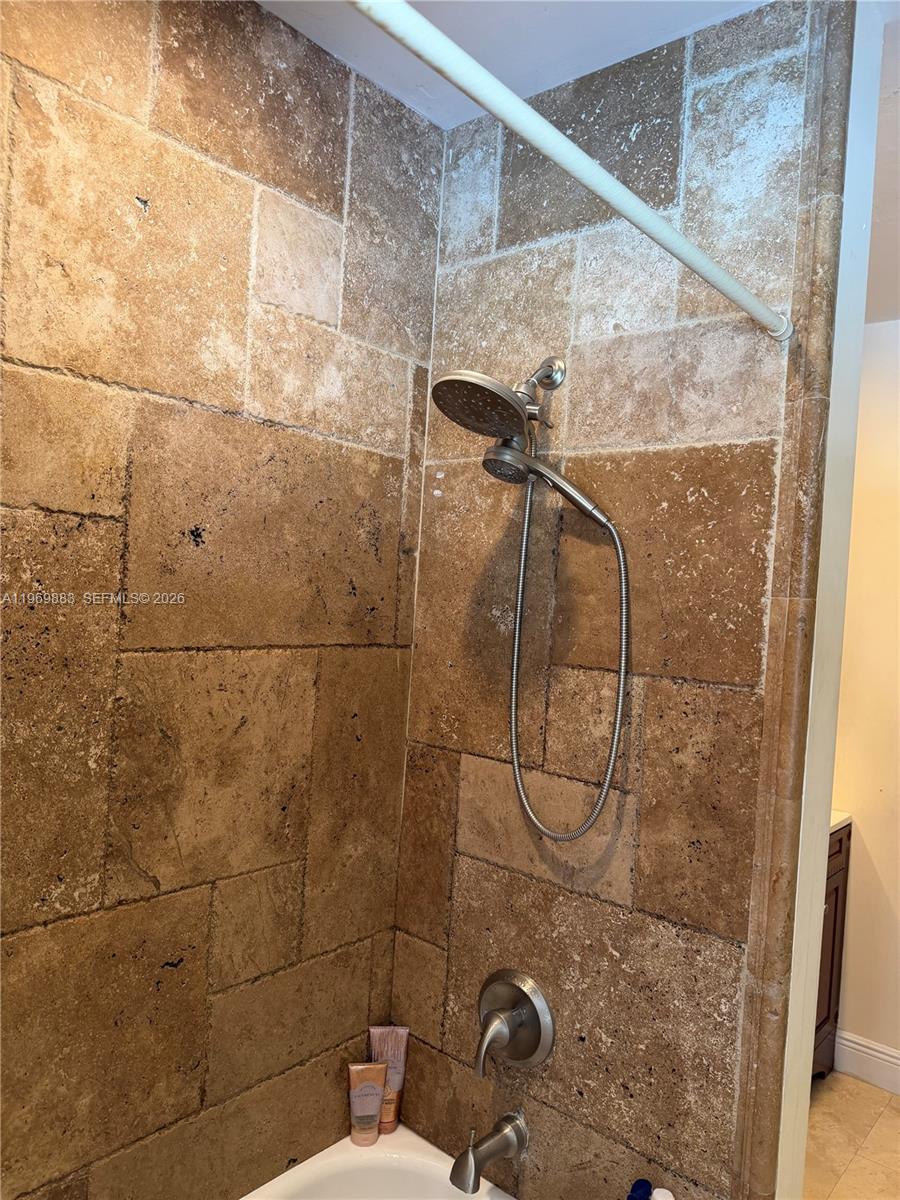15641 Southwest 147th Avenue Miami, FL 33187 - Photo 12 of 20 a bathroom with a shower