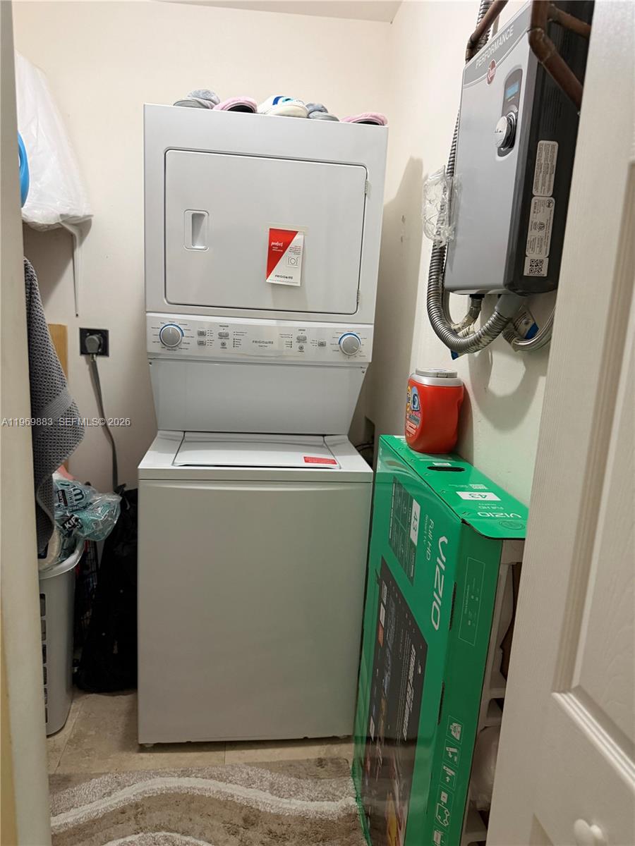 15641 Southwest 147th Avenue Miami, FL 33187 - Photo 14 of 20 a utility room with dryer and washer