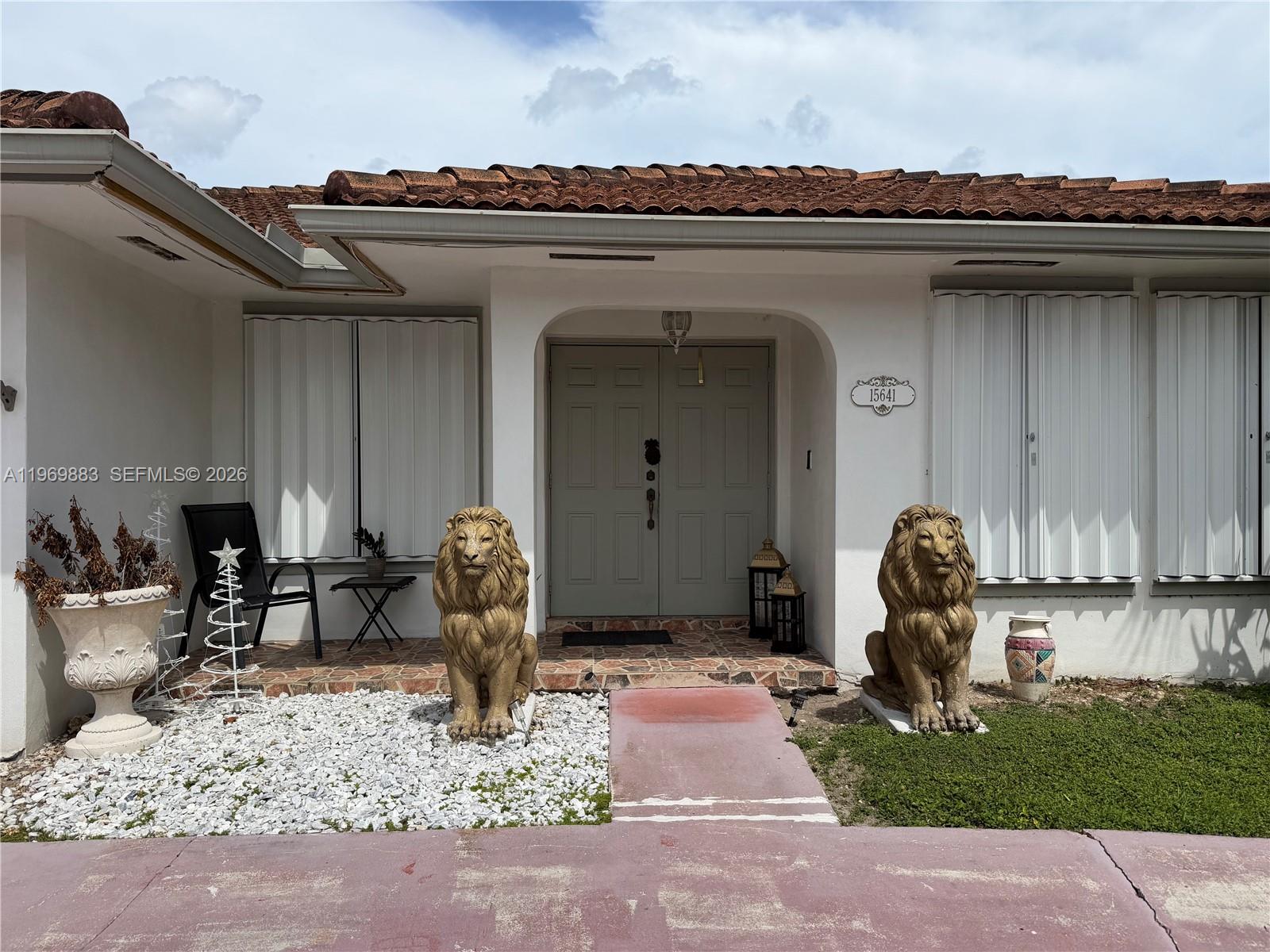 15641 Southwest 147th Avenue Miami, FL 33187 - Photo 2 of 20 a front view of a house