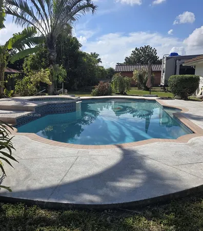a view of a swimming pool with a patio