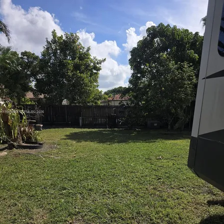 a view of backyard with green space