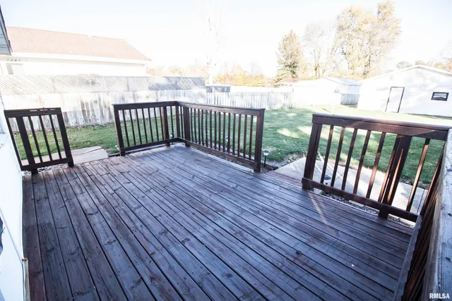 a view of balcony with wooden floor