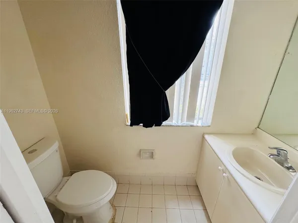 a bathroom with a sink a toilet and a tub