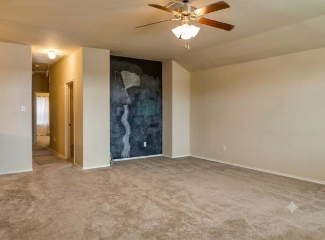 415 Harding Lane Lavon, TX 75166 - Photo 7 of 13 Spacious room featuring neutral carpet flooring, light-toned walls, and a ceiling fan with integrated lighting
