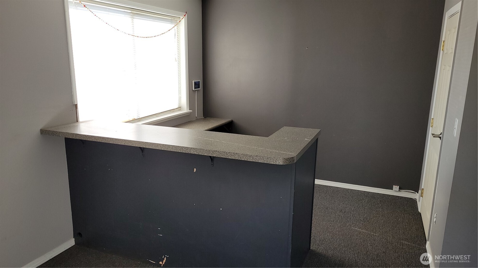 847 Blake Street Enumclaw, WA 98022 - Photo 2 of 5 a bathroom with a granite countertop sink and window