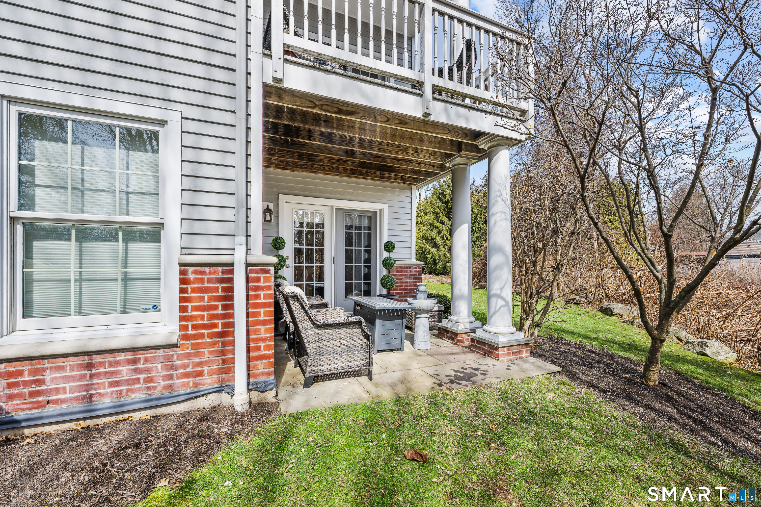 71 Aberdeen Way, Unit 71 Fairfield, CT 06890 - Photo 33 of 37 a view of a house with backyard and sitting area
