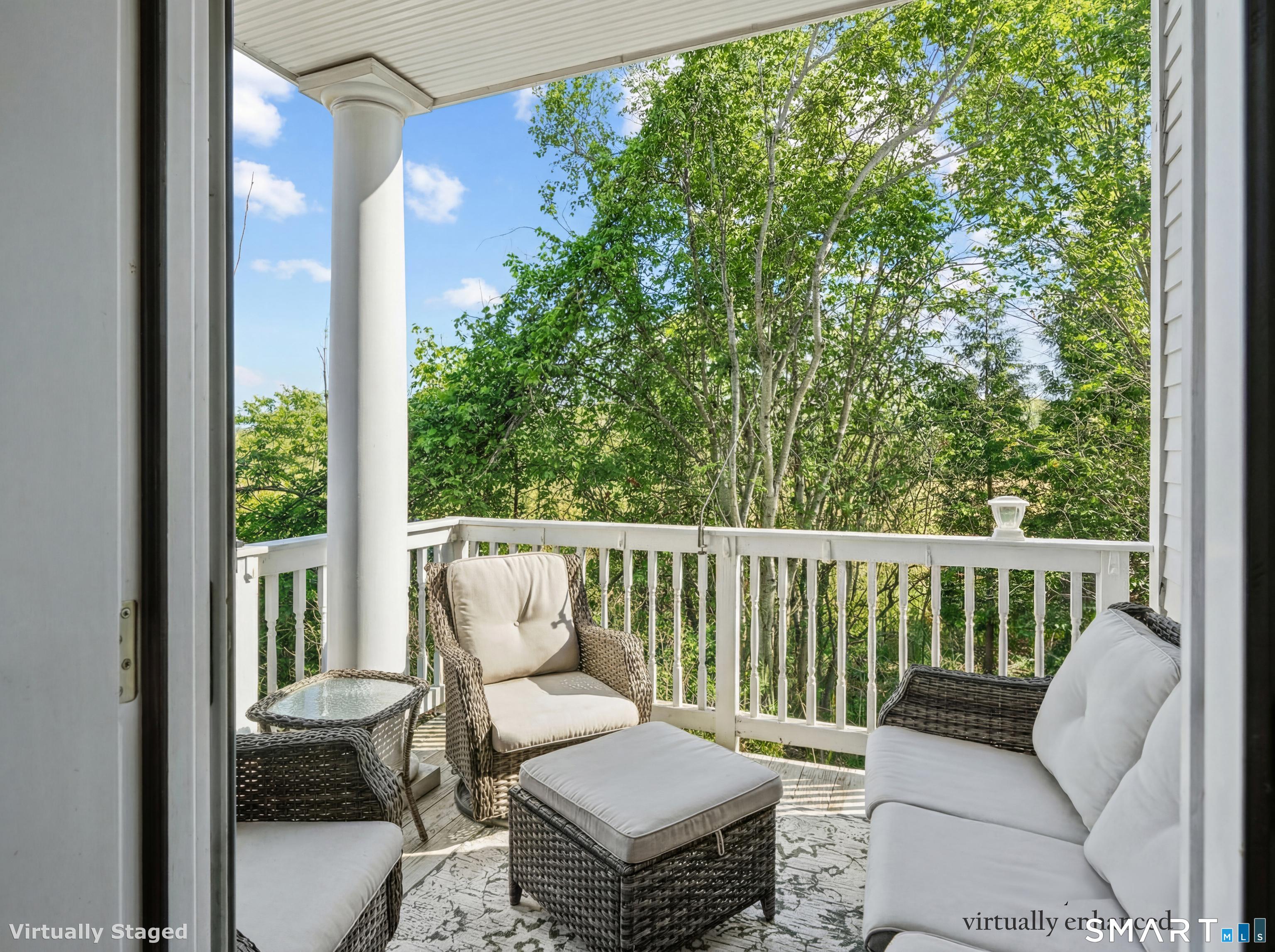 71 Aberdeen Way, Unit 71 Fairfield, CT 06890 - Photo 36 of 37 a balcony with wooden floor and outdoor seating