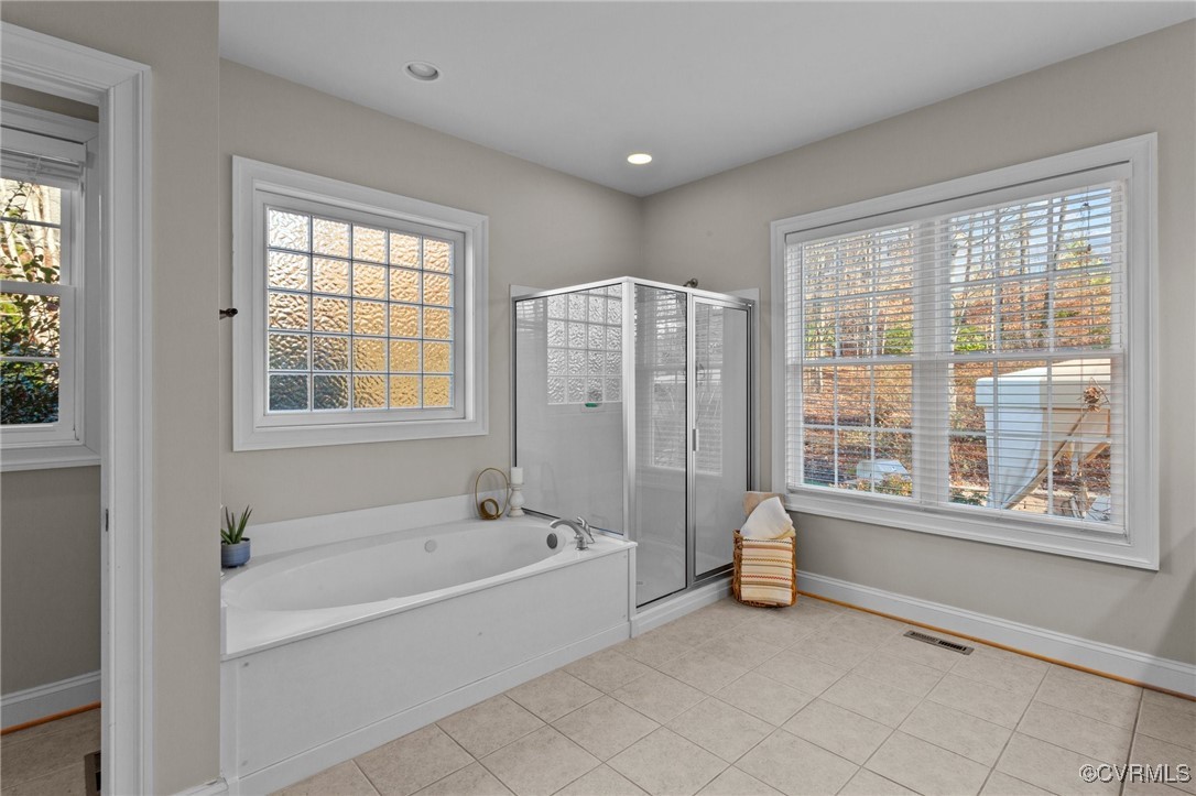 14337 Riverdowns S Drive Midlothian, VA 23113 - Photo 19 of 44 a spacious bathroom with a bathtub and a shower