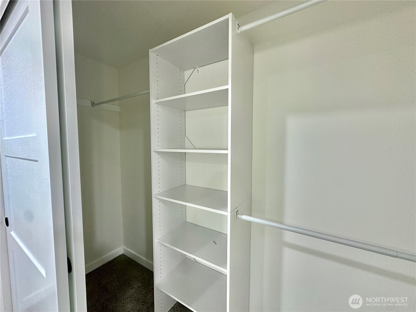 7044 Johnson Point Road Northeast Olympia, WA 98516 - Photo 16 of 36 a view of walk in closet with empty racks