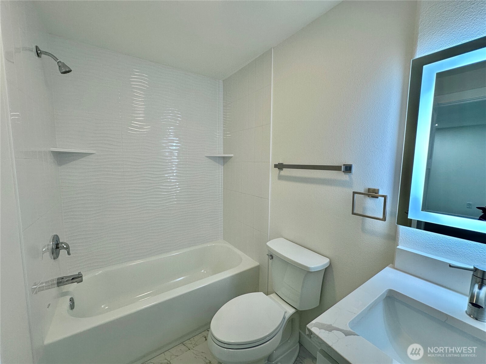 7044 Johnson Point Road Northeast Olympia, WA 98516 - Photo 23 of 36 a white toilet sitting next to a bath tub