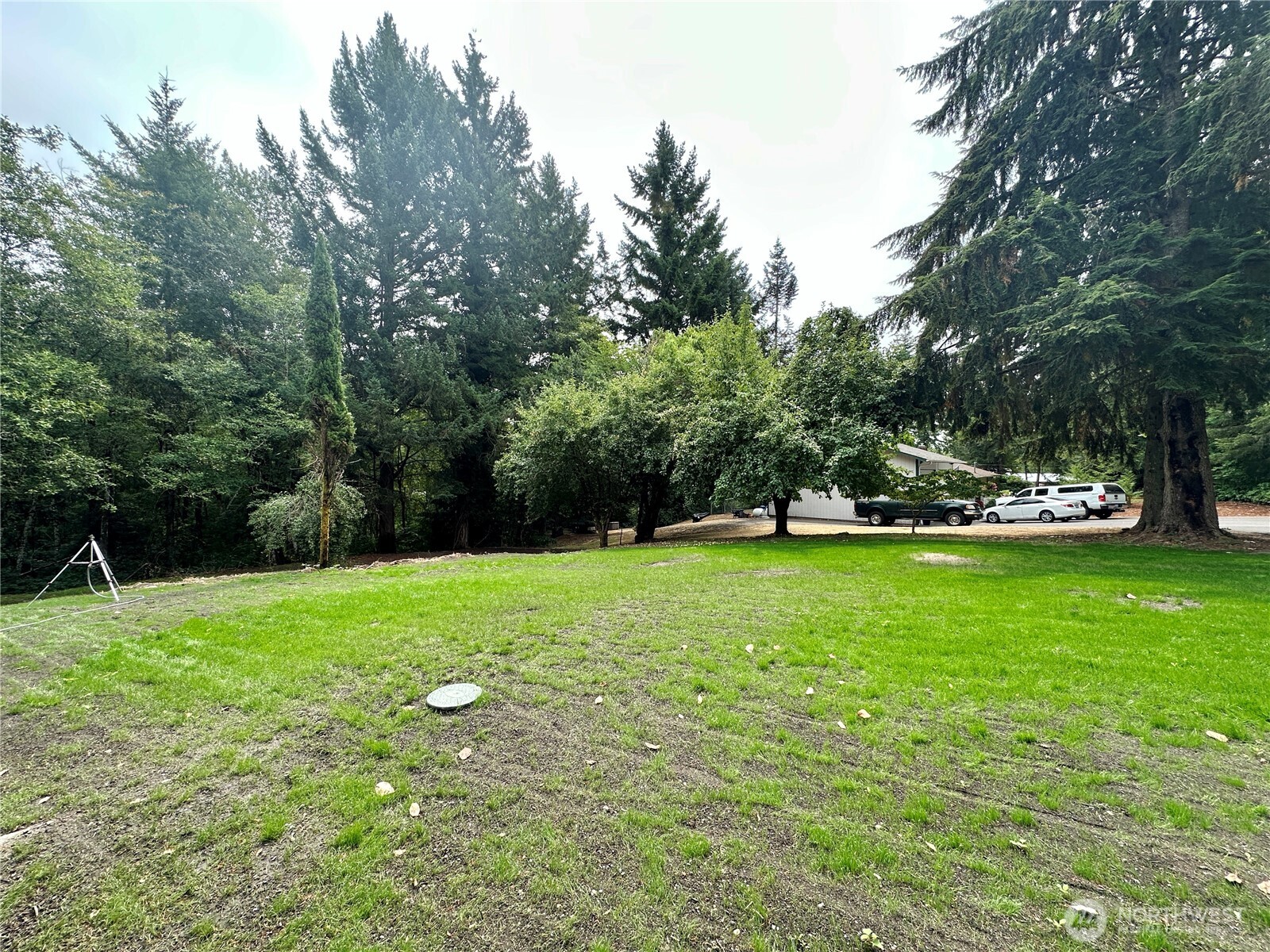 7044 Johnson Point Road Northeast Olympia, WA 98516 - Photo 28 of 36 a view of outdoor space with deck and yard