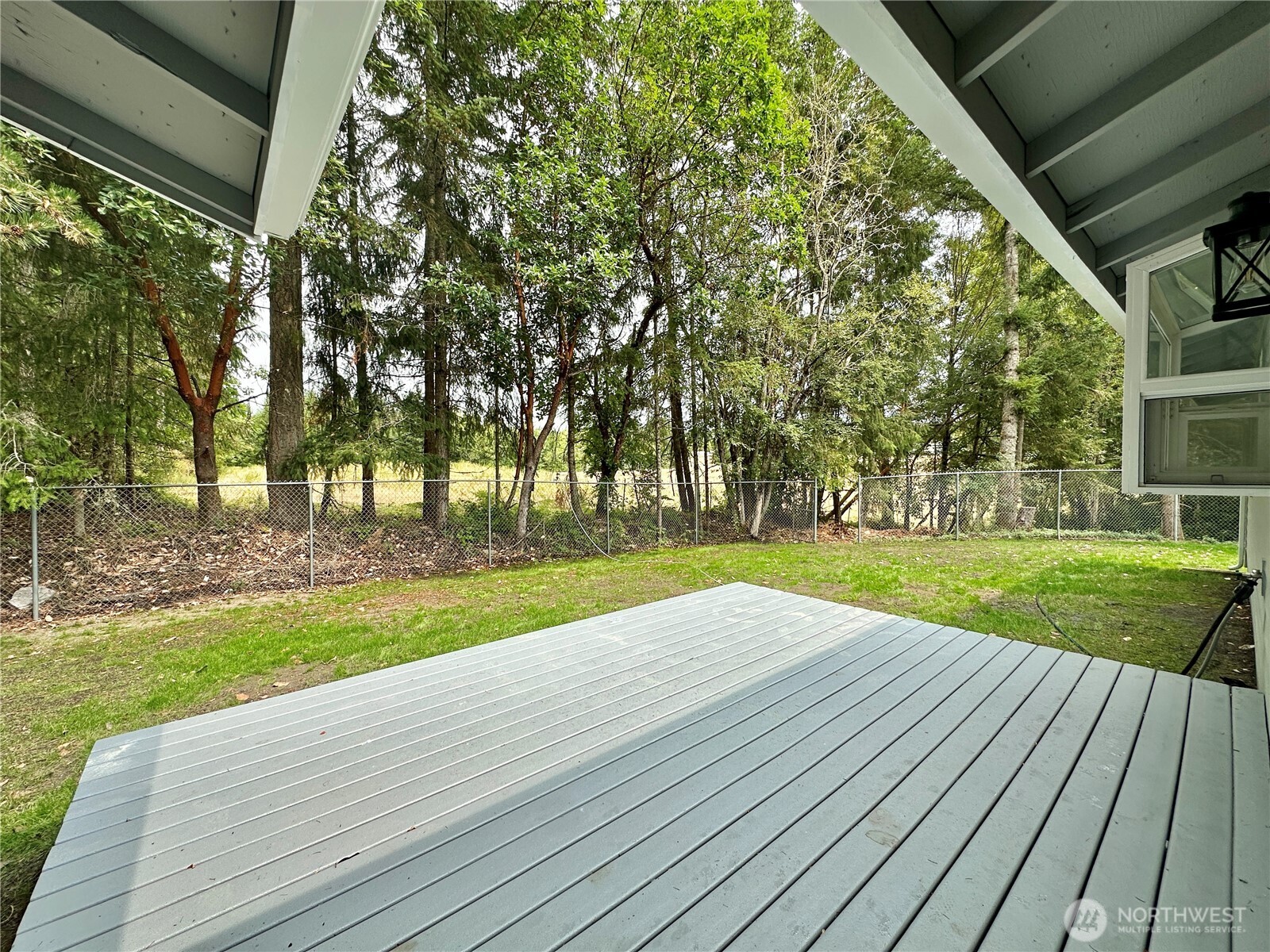 7044 Johnson Point Road Northeast Olympia, WA 98516 - Photo 31 of 36 a view of a house with yard