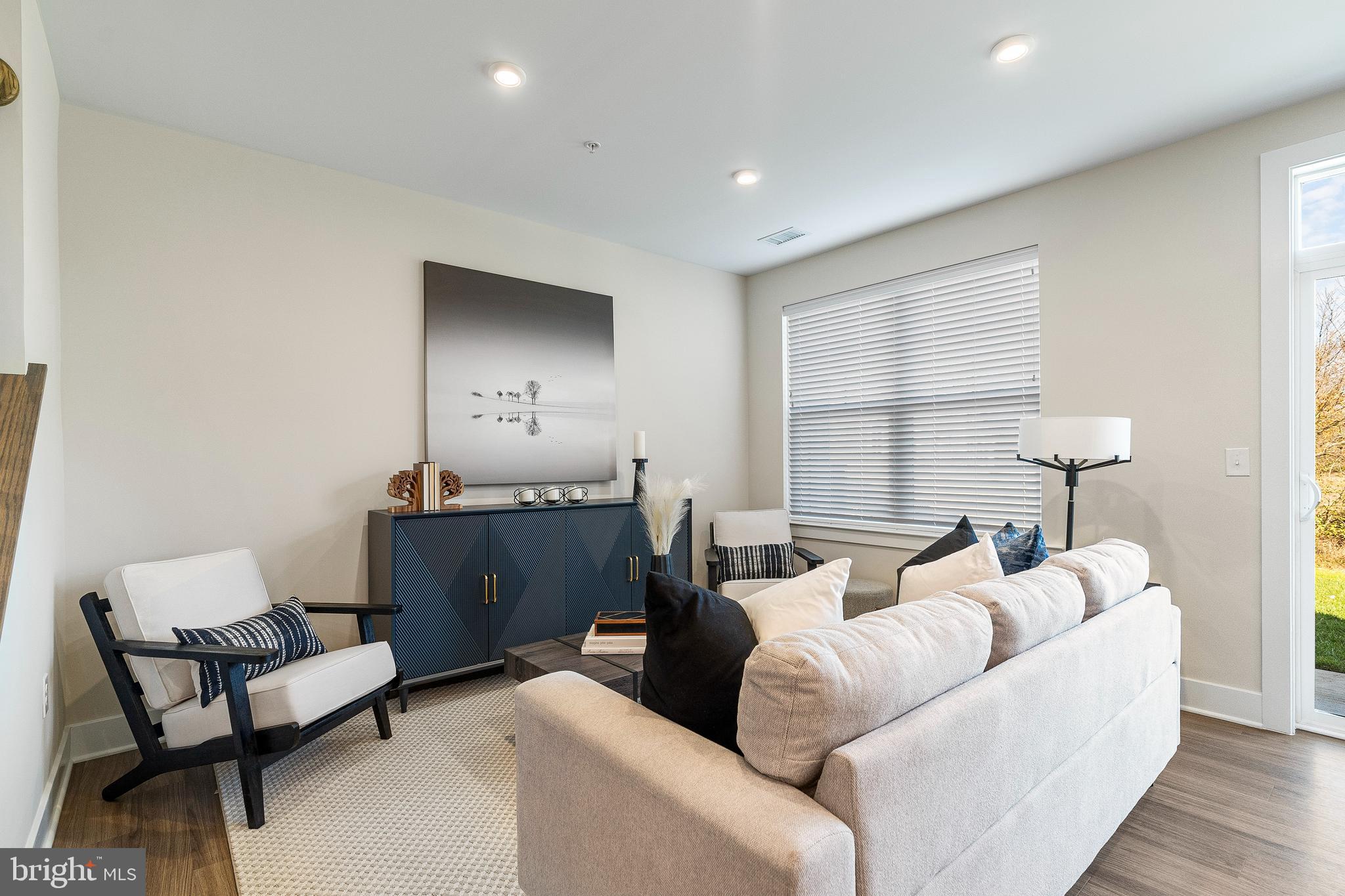 7 Mainland Road, Unit 102 Harleysville, PA 19438 - Photo 16 of 30 a living room with furniture and a window