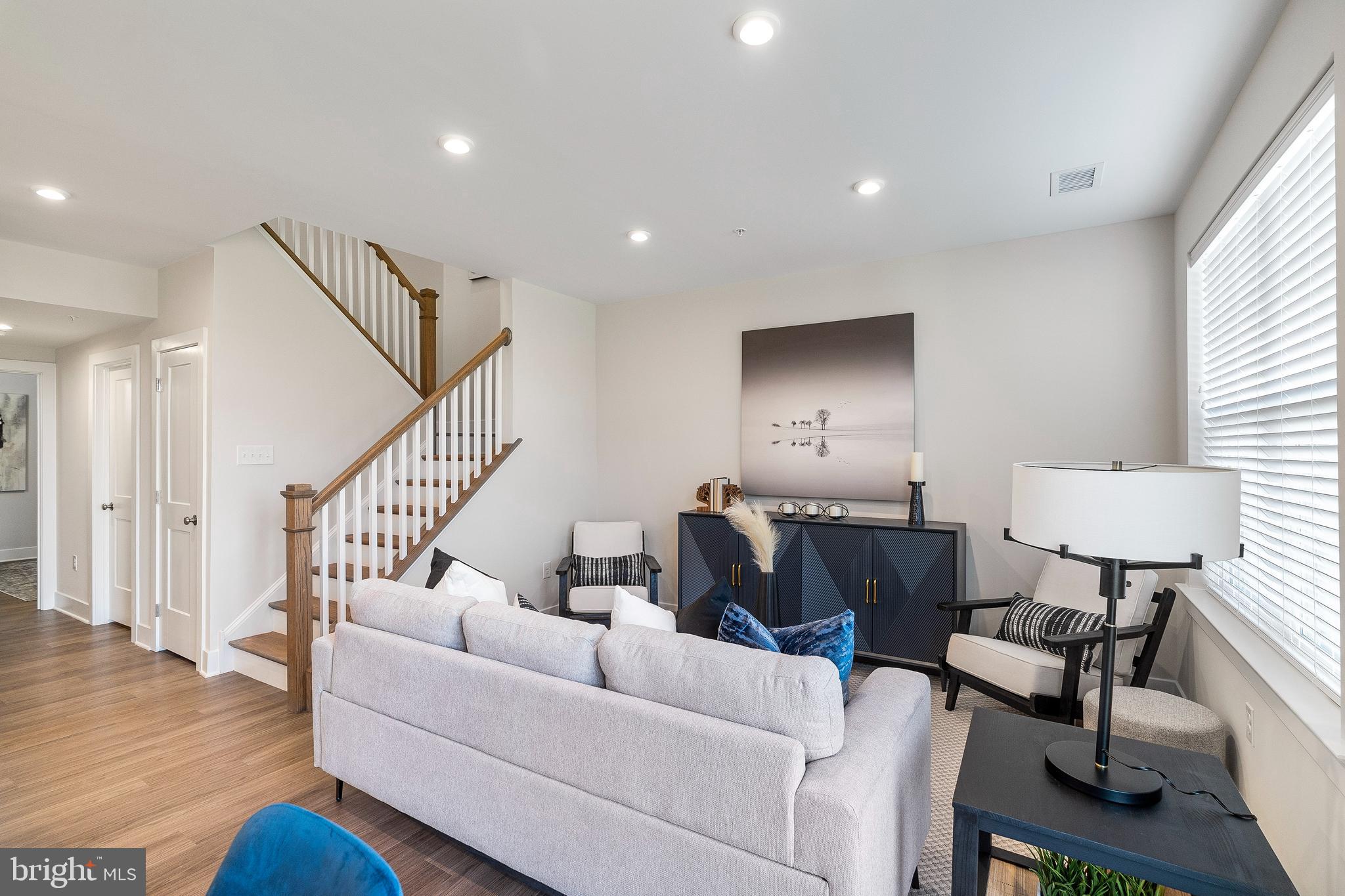 7 Mainland Road, Unit 102 Harleysville, PA 19438 - Photo 20 of 30 a living room with furniture and wooden floor