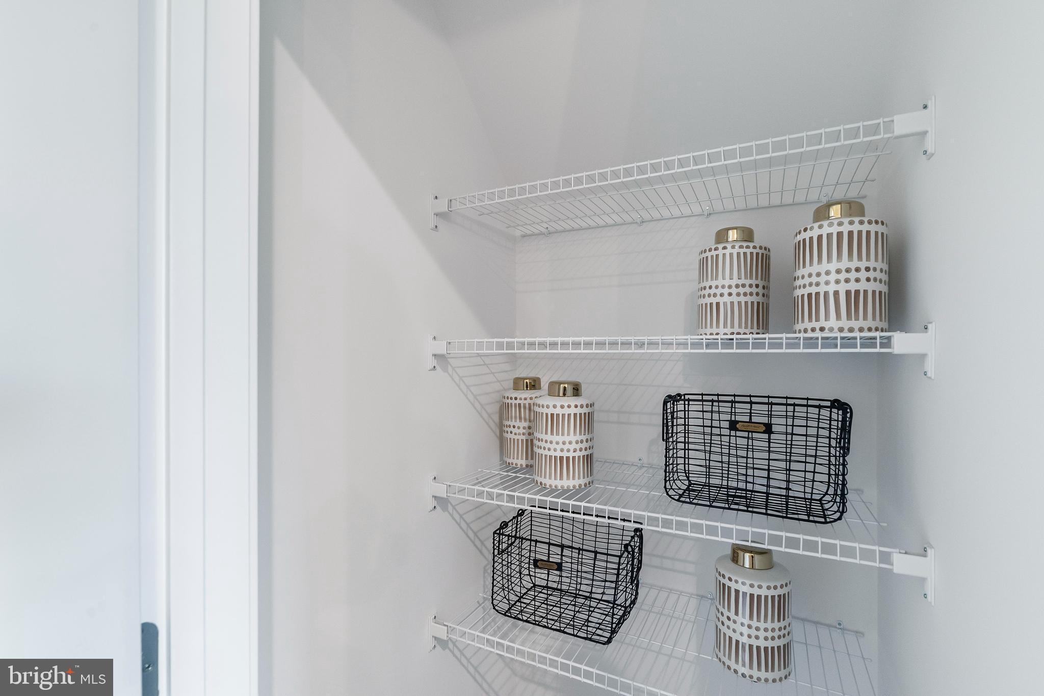 7 Mainland Road, Unit 102 Harleysville, PA 19438 - Photo 25 of 30 a view of storage and utility room with racks on the wall