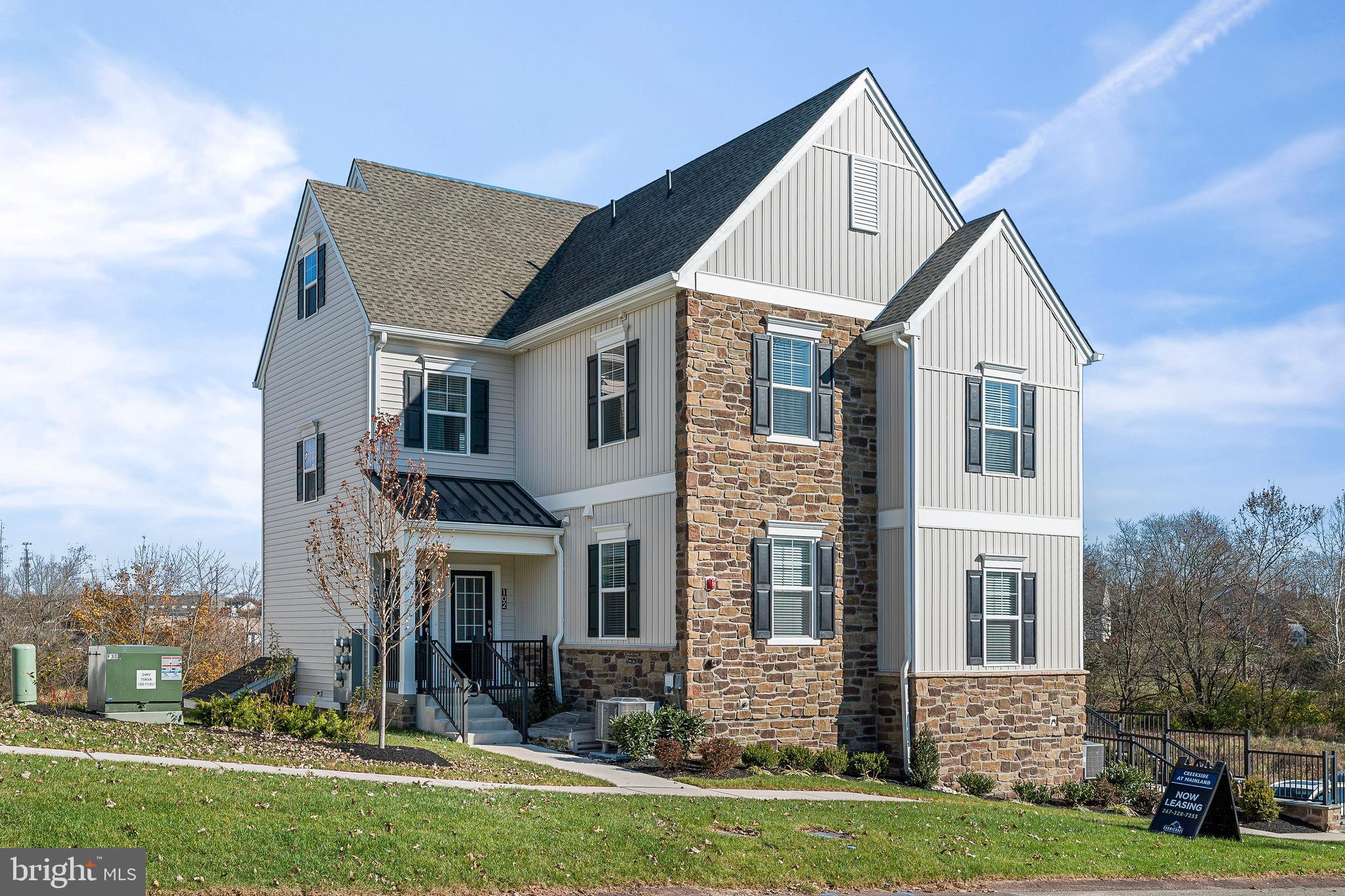 7 Mainland Road, Unit 102 Harleysville, PA 19438 - Photo 29 of 30 a view of a house with a yard