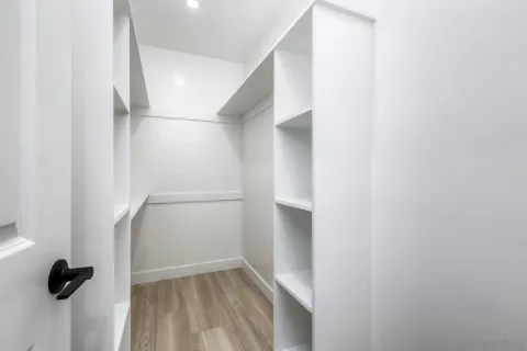 a bathroom with a sink vanity mirror and toilet