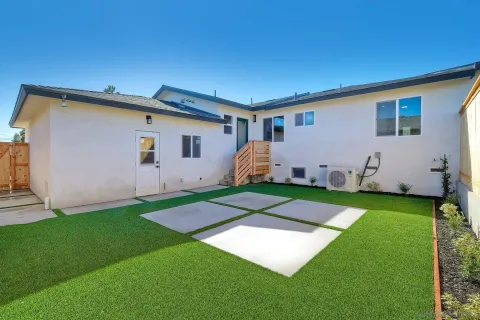 a bedroom with bed and a night stand