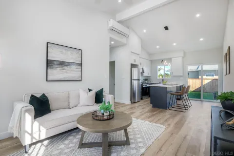 a view of a backyard with potted plants and wooden fence