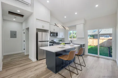 a view of a backyard with wooden fence