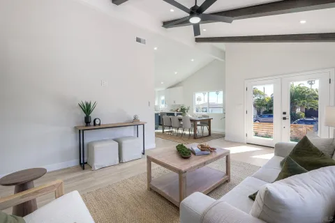 a spacious bedroom with a bed and a window